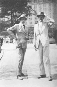 Two dapper-looking men in casual suits in 1950s clothes.