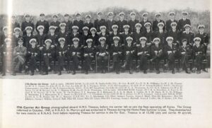 Sailors in their dress uniforms sit for their portrait.