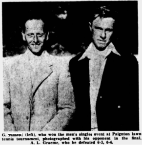 Two men smile for the camera.