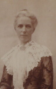 Picture of a woman in Victorian clothes.