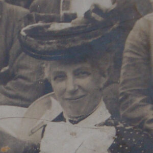 Smiling woman in a hat.