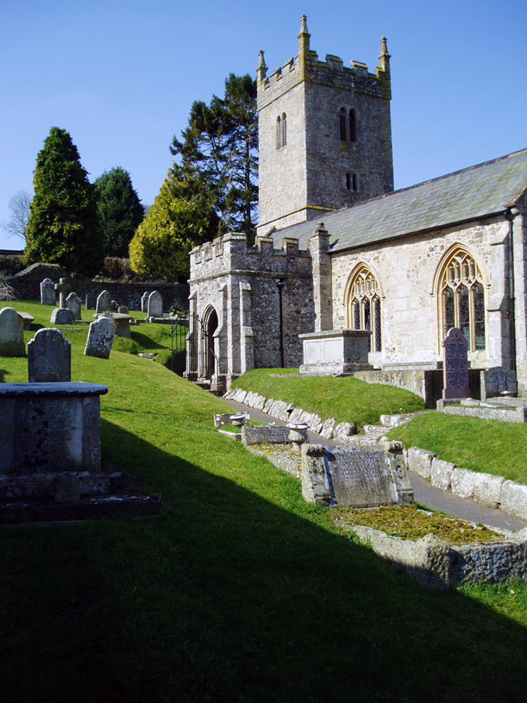 Stone church surrounded by graves.