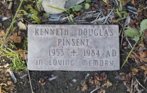 Small square grave marker reading Kenneth Douglas Pinsent 1953 to 1984 In loving memory.