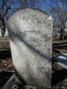 A rounded gravestone bearing the name Charles Speare Pinsent
