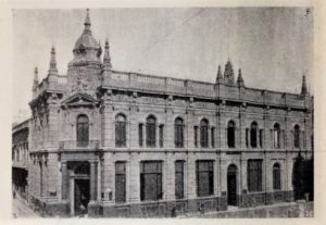 An old fading photograph of an impressive stone building