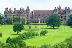 A photograph of a grand series of stone school buildings