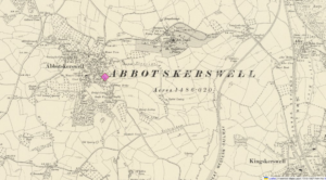 A yellowed map of Abbotskerswell with a pink diamond marking the placement of the farm.