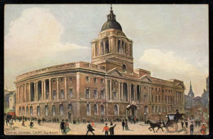 Painting of an ornate red stone court building. People crowd around below.