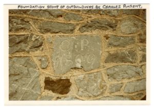 The letters C. P. 1809 are scraped into a stone sealed with mortar into a floor or wall.