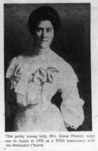Photo from a newspaper of a 1900s young woman with dark hair and a white dress. It describes her as a perky young lady.