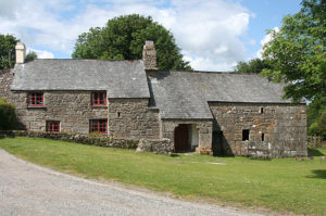 An unusual, long building made of stone.