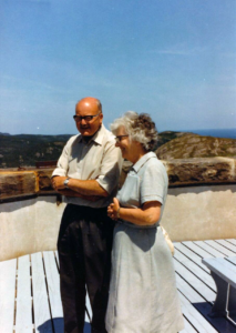 Robin and Ruth, both seniors now, stand smiling in the sun.