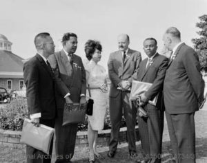 Robin stands amidst a small group of doctors from across the globe.