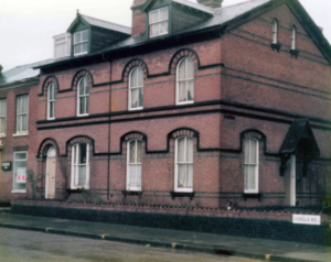 A red-brick two story building.