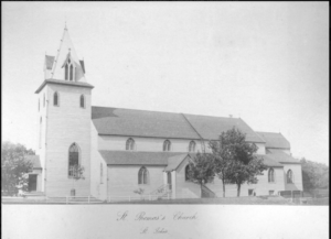 Black and white photograph of a simple white church building.