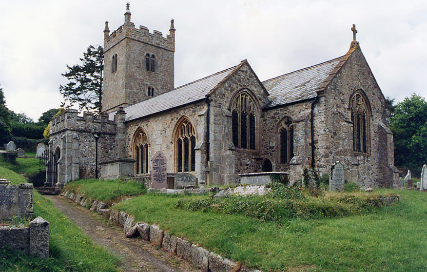 Modern photograph of an old stone church with a graveyard in front.