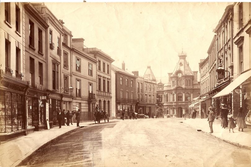 Sepia-toned black and white photograph of Fire Street, Tiverton, circa 1900.